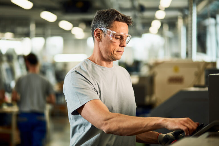 industrial engineer operating cnc machine production line